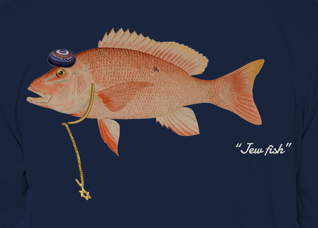 Close-up of the red snapper print on navy fabric: kippah, Star of David chain, Jew fish script