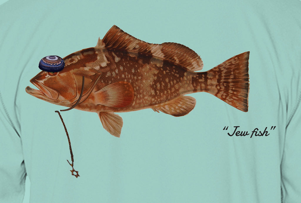 Close-up of the red grouper print on seafoam fabric: kippah, Star of David chain, Jew fish script