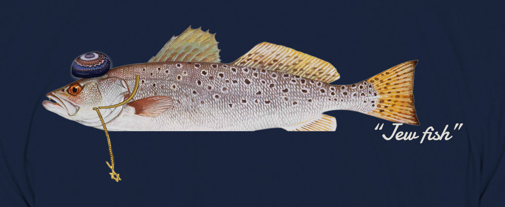 Close-up of the speckled trout print on navy fabric: kippah, Star of David chain, Jew fish script
