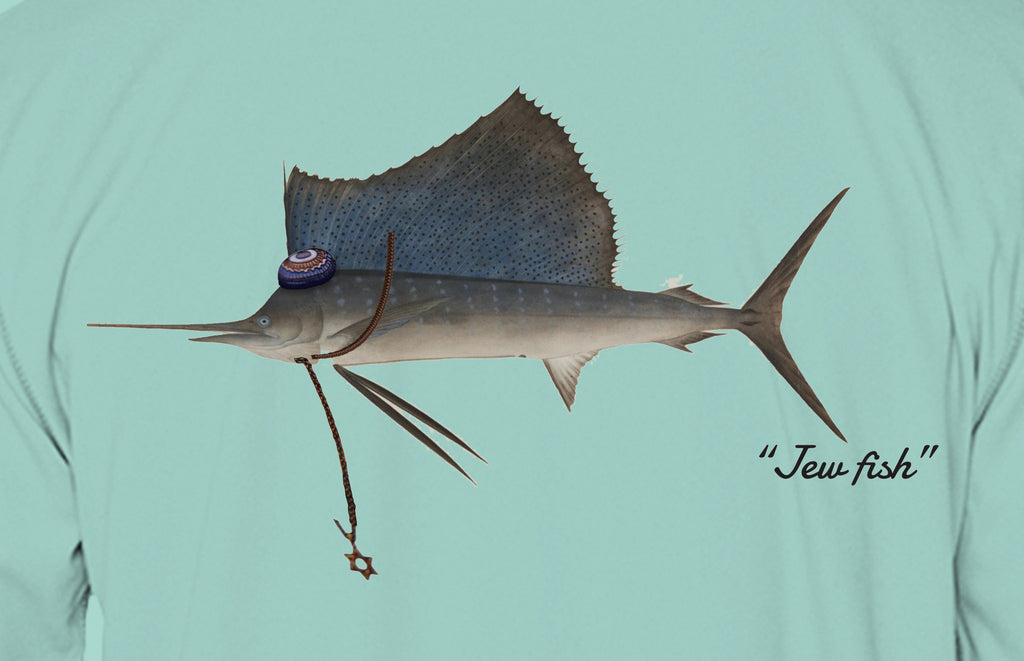 Close-up of the sailfish print on seafoam fabric: kippah, Star of David chain, Jew fish script