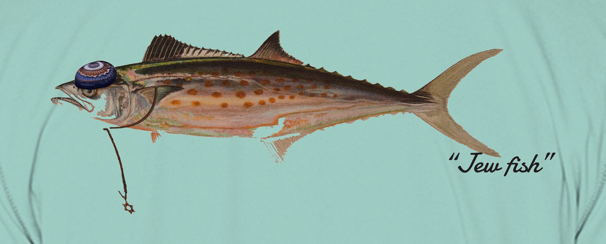 Close-up of the Spanish mackerel print on seafoam fabric: kippah, Star of David chain, Jew fish script